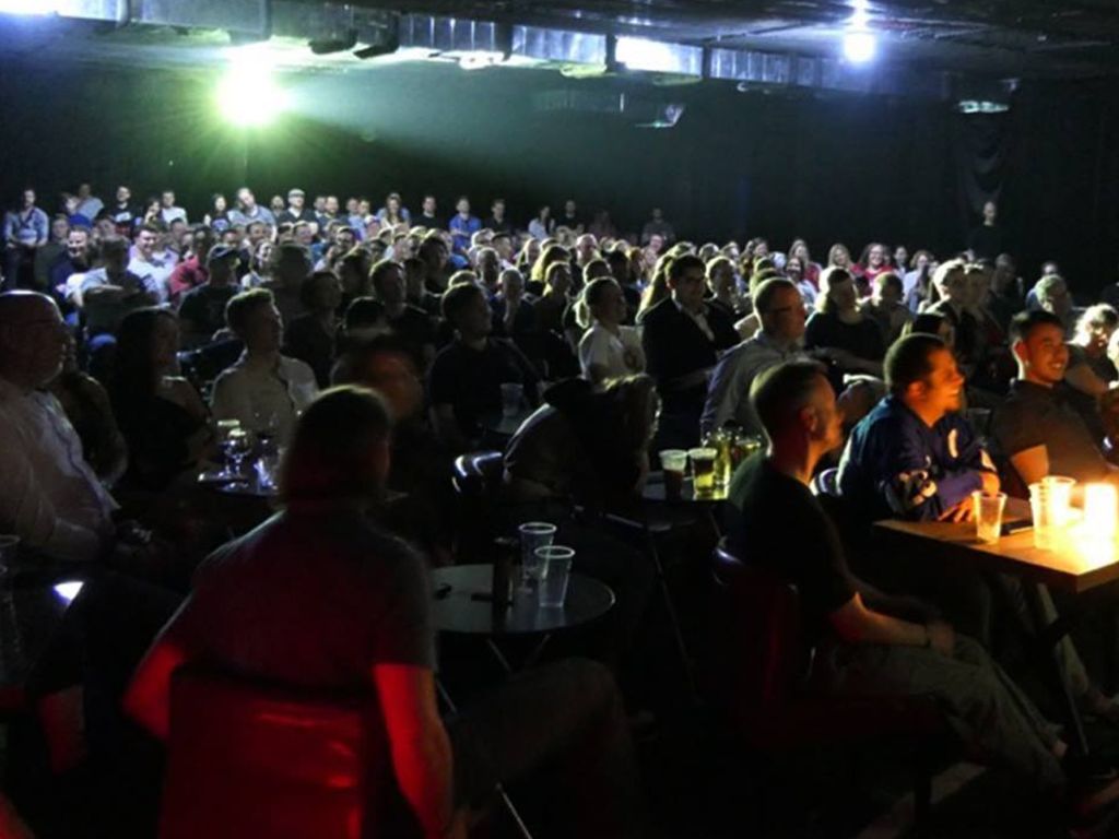 Comedy Corner venue - intimate atmosphere with candle-lit tables